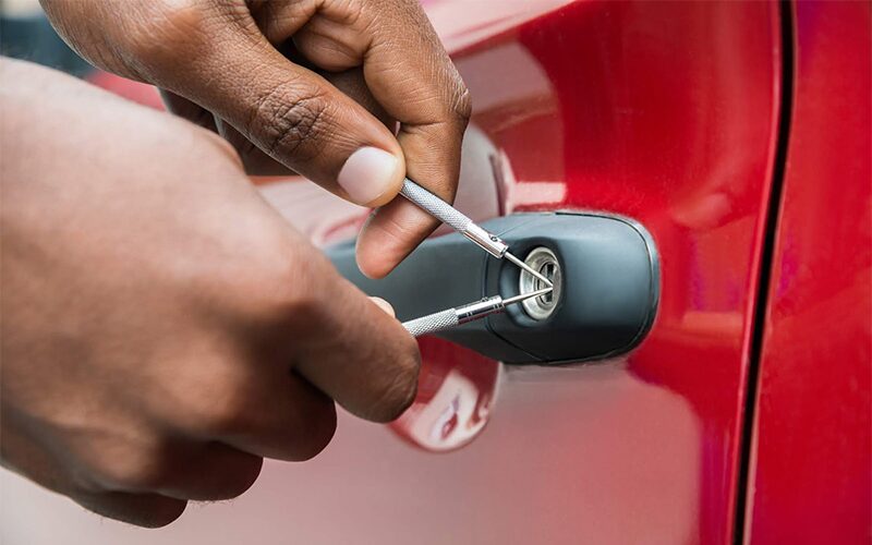 PM Locksmiths locksmith opening a locked vehicle without damage on a night call-out